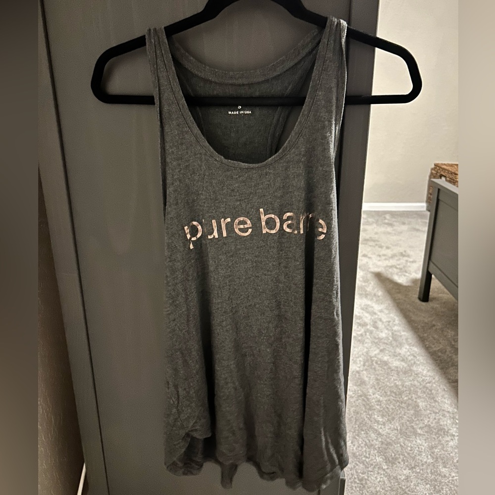 Pure barre razorback tank with stars. Size small.